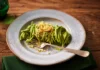 Noodles served with a sauce made from green cabbage