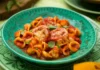 Orecchiette made from scratch served with tomato sauce and roasted tomatoes