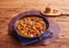Dish of Japanese mint served with potato, carrot, and curry.