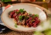 Noodles made from beets served with sardines