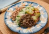 Rice, beans, minced meat, and chayote salad